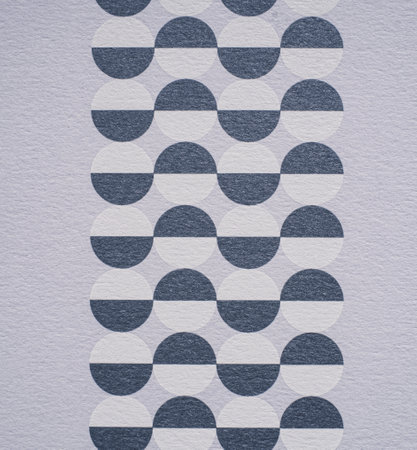 A dense industrial sheet of grey paper with a textured surface and geometric shapes