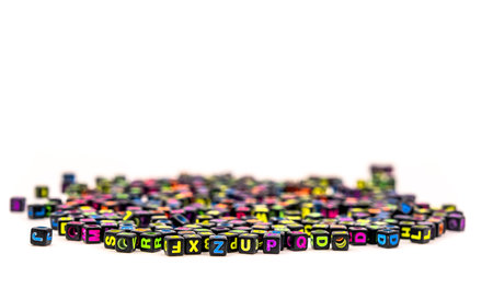 black square beads with letters on white background