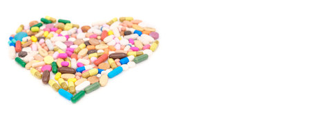 group of drugs or medicines arrange in heart shape isolated on whiteの写真素材