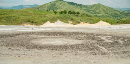 Mud volcanoess closeup view. Buzau county, Romania. (unique geological phenomenon in Europe where the earth gas reaches the surface through hills making small Mud volcanoes)の写真素材