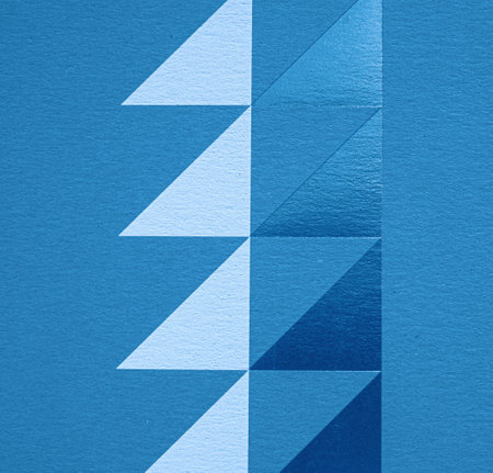 A dense industrial sheet of grey paper with a textured surface and geometric shapesの写真素材