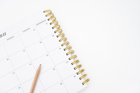 Spiral Notebook with wooden Pen on white background.の写真素材