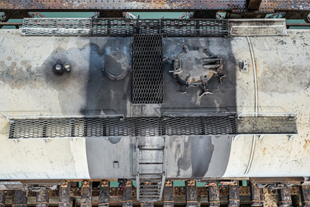 train cars on the bridge over the water seen from aboveの写真素材