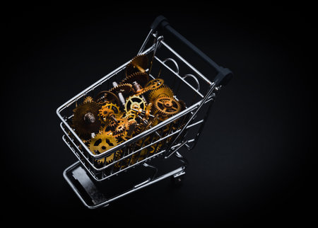 shopping cart with Vintage cogs gears wheels collection set on black backgroundの写真素材