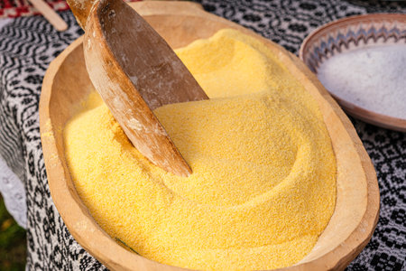 wooden spoon in the hominy bowl
