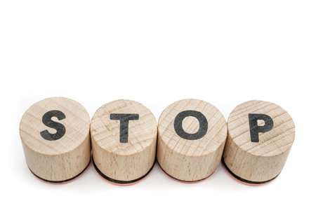 Stop Word Written in Wood Blocksの写真素材
