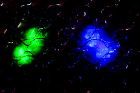 Green and blue LED lights on a black background. Abstract background.
