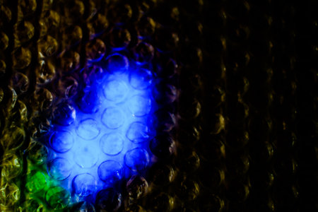 abstract background bokeh circles of light in the dark.