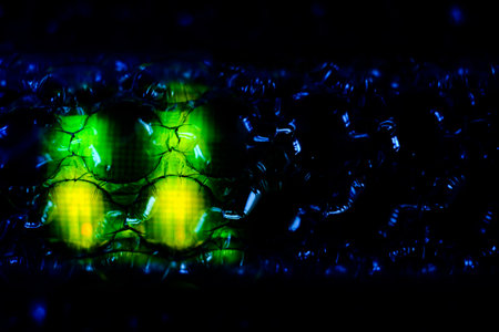 abstract background with green and yellow led lights on a black background