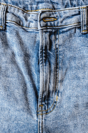Details from jeans pants with seams and pockets