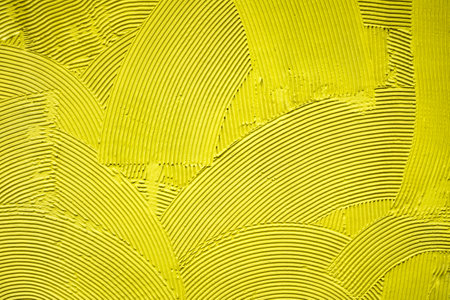 Yellow decorative relief plaster on wallの写真素材