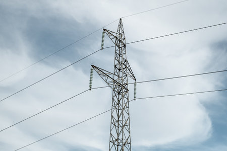 High voltage pole on cloudy sky