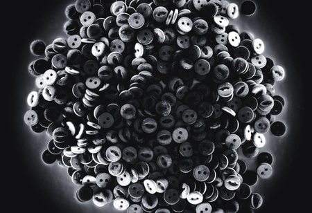 a lot of plastic buttons on dark backgroundの写真素材