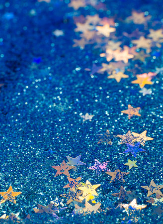 blue sparkles and multicolour stars backgroundの写真素材