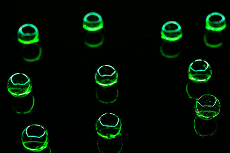 green glass balls on black backgroundの写真素材