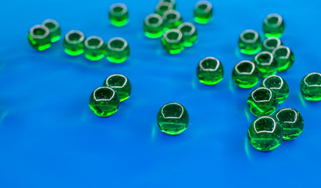green glass balls on blue backgroundの写真素材