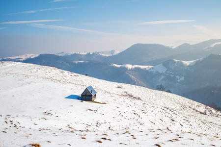 sun over the winter mountains with snow, Cindrel mountains, Paltinis, Romaniaの写真素材