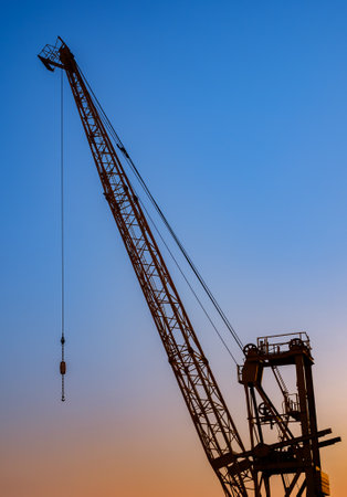 silhouette crane construction site on sunset time