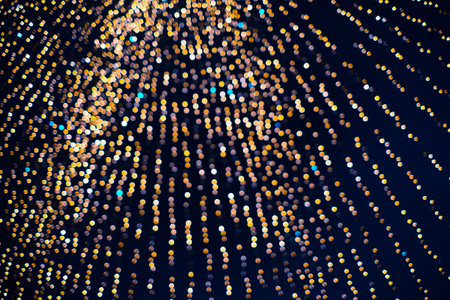 Abstract orange and blue bokeh texture on dark blue backgroundの写真素材