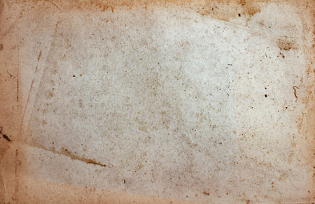 Aging, worn paper with water stains and rough edgesの写真素材