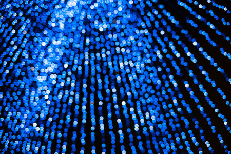 Abstract blue bokeh texture on dark backgroundの写真素材