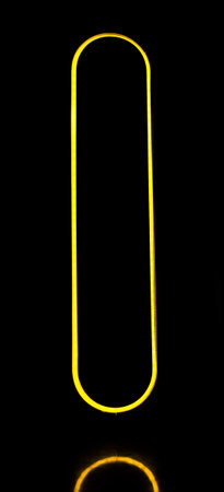 abstract yellow LED light elipse shape on black backgroundの写真素材