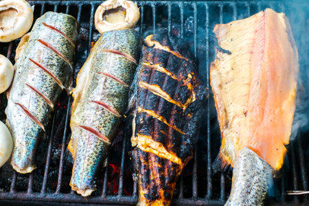 Fresh trout on grill directly taken from waterの写真素材