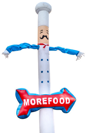 inflatable chef doll blowing in the wind with white chef hat and red arrow with message isolated on whiteの写真素材