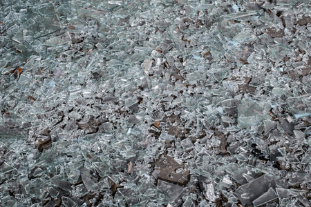 pieces of broken glass on the floorの写真素材