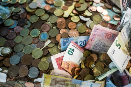 pile of coins and banknotes from different countries