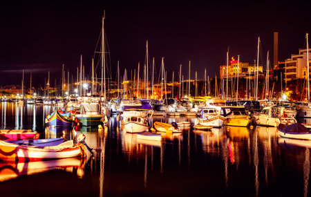 small boats anchored in the bay at night, Msida Yacht Marina, Maltaの写真素材
