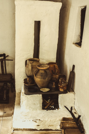 Sibiu city, Romania - August 17, 2019. Traditional Romanian folk house interior with rural furniture and decoration. Astra Museum of Traditional Folk Civilization, Sibiuのeditorial素材