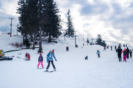 Paltinis Arena Platos, Romania - January 11, 2020. Lots of people on a mountain slope at ski resort in Paltinis Arena Platos. Paltinis Arena Platos is a most popular ski resort in Sibiu, Romaniaのeditorial素材
