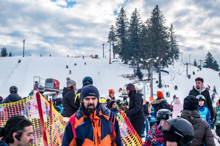 Paltinis Arena Platos, Romania - January 11, 2020. Lots of people on a mountain slope at ski resort in Paltinis Arena Platos. Paltinis Arena Platos is a most popular ski resort in Sibiu, Romaniaのeditorial素材