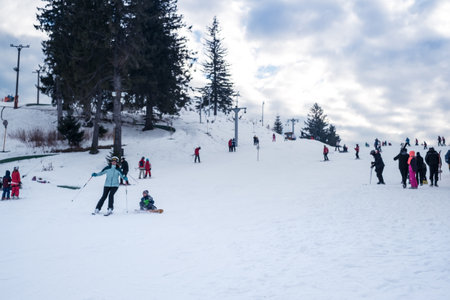 Paltinis Arena Platos, Romania - January 11, 2020. Lots of people on a mountain slope at ski resort in Paltinis Arena Platos. Paltinis Arena Platos is a most popular ski resort in Sibiu, Romaniaのeditorial素材