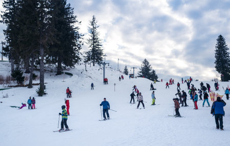 Paltinis Arena Platos, Romania - January 11, 2020. Lots of people on a mountain slope at ski resort in Paltinis Arena Platos. Paltinis Arena Platos is a most popular ski resort in Sibiu, Romaniaのeditorial素材