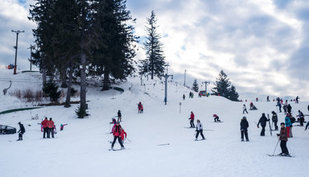 Paltinis Arena Platos, Romania - January 11, 2020. Lots of people on a mountain slope at ski resort in Paltinis Arena Platos. Paltinis Arena Platos is a most popular ski resort in Sibiu, Romaniaのeditorial素材