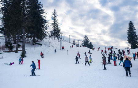 Paltinis Arena Platos, Romania - January 11, 2020. Lots of people on a mountain slope at ski resort in Paltinis Arena Platos. Paltinis Arena Platos is a most popular ski resort in Sibiu, Romaniaのeditorial素材