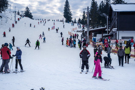 Paltinis Arena Platos, Romania - January 11, 2020. Lots of people on a mountain slope at ski resort in Paltinis Arena Platos. Paltinis Arena Platos is a most popular ski resort in Sibiu, Romaniaのeditorial素材