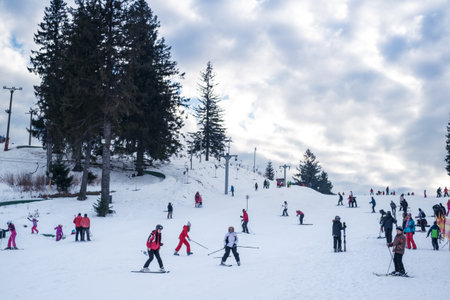 Paltinis Arena Platos, Romania - January 11, 2020. Lots of people on a mountain slope at ski resort in Paltinis Arena Platos. Paltinis Arena Platos is a most popular ski resort in Sibiu, Romaniaのeditorial素材