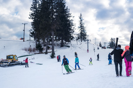 Paltinis Arena Platos, Romania - January 11, 2020. Lots of people on a mountain slope at ski resort in Paltinis Arena Platos. Paltinis Arena Platos is a most popular ski resort in Sibiu, Romaniaのeditorial素材