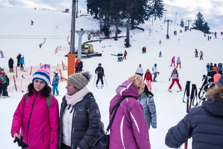 Paltinis Arena Platos, Romania - January 11, 2020. Lots of people on a mountain slope at ski resort in Paltinis Arena Platos. Paltinis Arena Platos is a most popular ski resort in Sibiu, Romaniaのeditorial素材