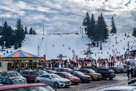 Paltinis Arena Platos, Romania - January 11, 2020. Lots of people on a mountain slope at ski resort in Paltinis Arena Platos. Paltinis Arena Platos is a most popular ski resort in Sibiu, Romaniaのeditorial素材