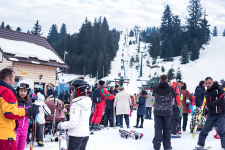 Paltinis Arena Platos, Romania - January 11, 2020. Lots of people on a mountain slope at ski resort in Paltinis Arena Platos. Paltinis Arena Platos is a most popular ski resort in Sibiu, Romaniaのeditorial素材
