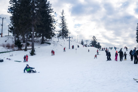 Paltinis Arena Platos, Romania - January 11, 2020. Lots of people on a mountain slope at ski resort in Paltinis Arena Platos. Paltinis Arena Platos is a most popular ski resort in Sibiu, Romaniaのeditorial素材