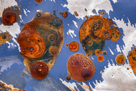 Abstract macro view of the paint and rust on the body of a carの写真素材