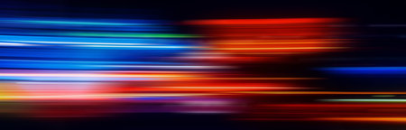 Abstract Rainbow light trails on the dark backgroundの写真素材