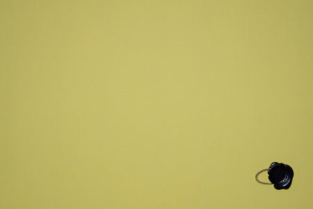 A dense industrial sheet of grey paper with wax seal with stringの写真素材