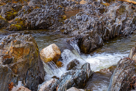 A mountain river flows between rocks in a cascade, Cindrel mountains, Sibiu, Romaniaの写真素材