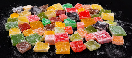 Assorted delicious Colorful Turkish Delights on dark backgroundの写真素材